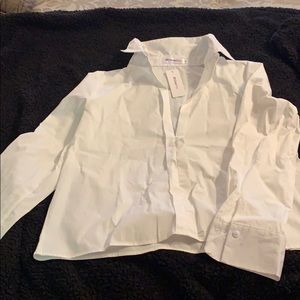 White blouse with plunging neckline.